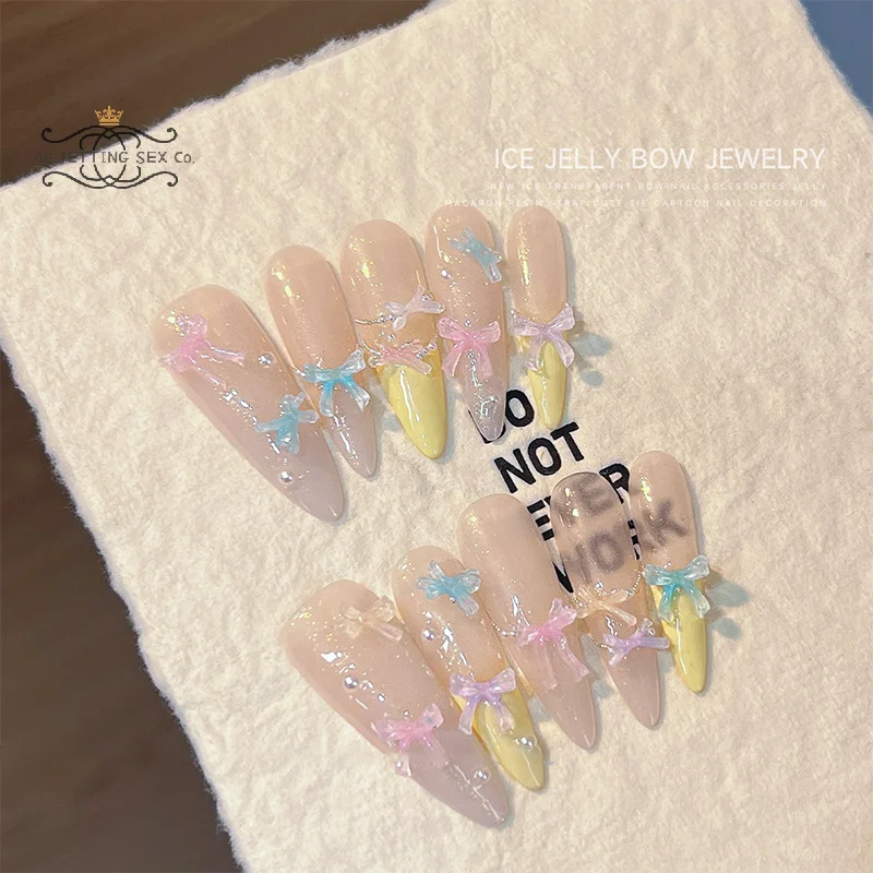 50pcs น้ําแข็งโปร่งใสสี Bowknots เรซิ่นตกแต่งเล็บ 3D มินิน่ารัก Bows เล็บ Charms สําหรับ DIY เล็บอุปกรณ์เสริม