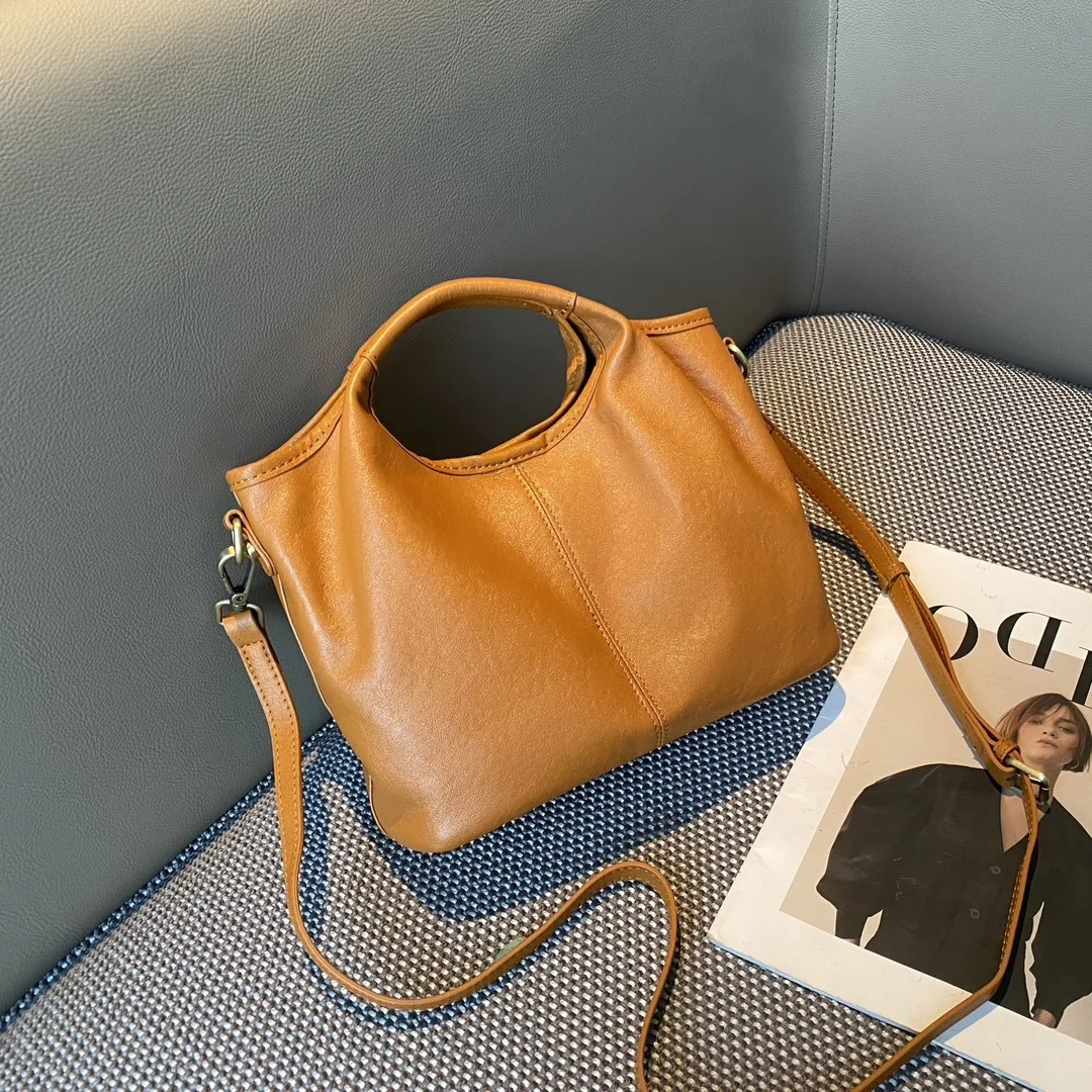

Head layer cowhide bucket bag for women, 2025 new retro handheld high-end leather shoulder cross shoulder bag for women
