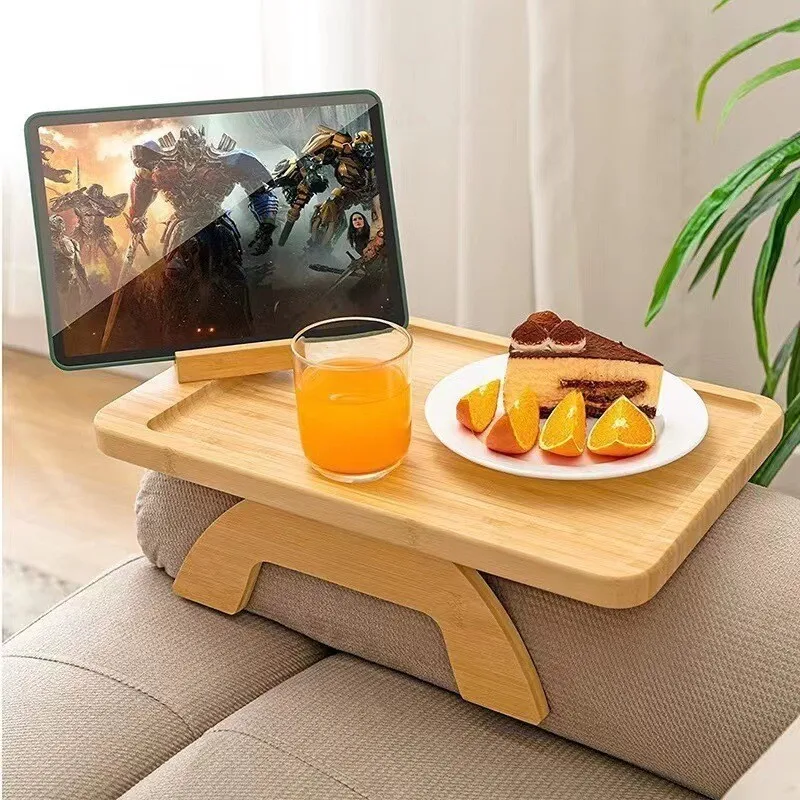 It is stuck on the armrest of sofa, tray belt is placed on side of the foot, tea table, water cup