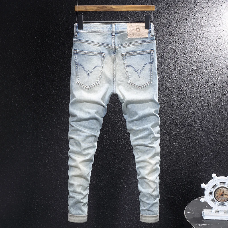 Y2Knew denim jeans, washed with nostalgia, elastic, slim fit, pleated, painted light blue jeans, high street embroidere