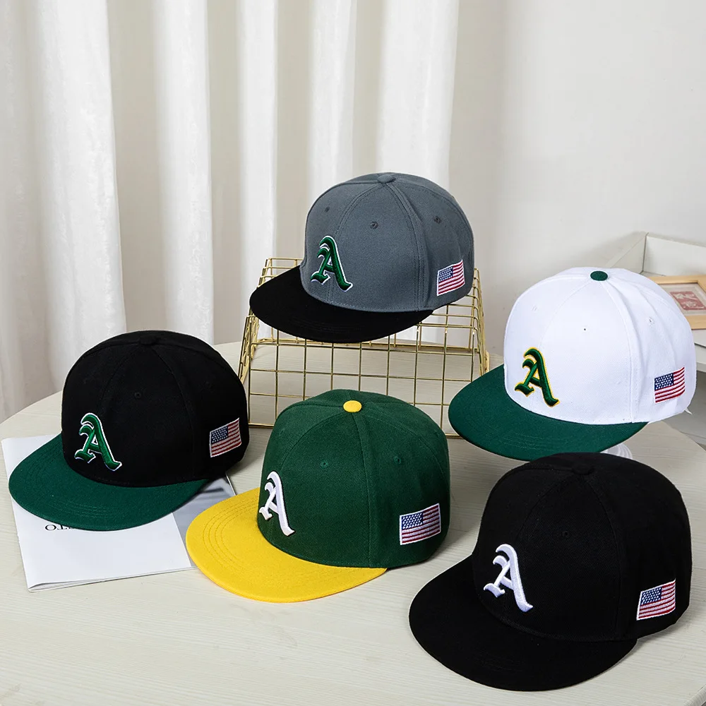 Hip-hop style baseball cap with a flat top, color patching, letter embroidery. Suitable for both women and men