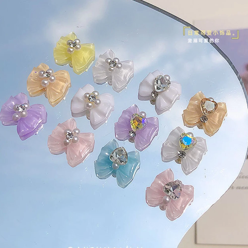 10pcs 3D Ice Transparent Bow Nail Art Charms 14*13mm Ribbon Bowtie Heart Rhinestone Nail Parts Pretty Resin Bowknot Nail Accesso