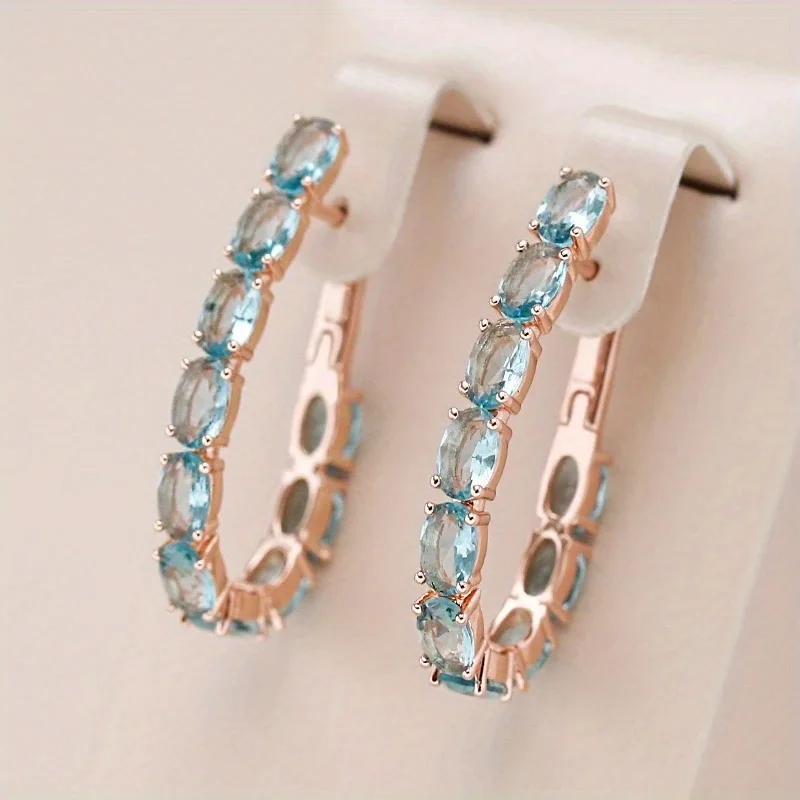 Luxuriöse Goldfarbene Meeresblaue CZ Hängeohrringe für Damen Oval Modisch für Party und Alltag