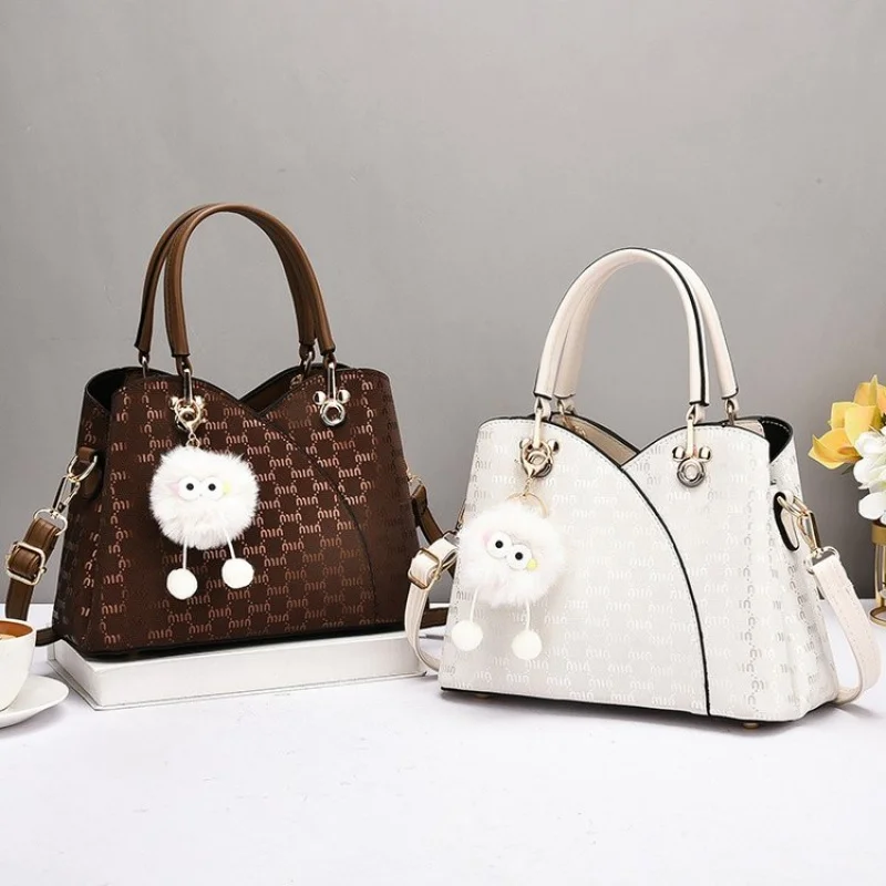 

Women's Handbag With Leather Accents, Convertible Shoulder To Crossbody, Popular Elegant Choice For Modern Ladies