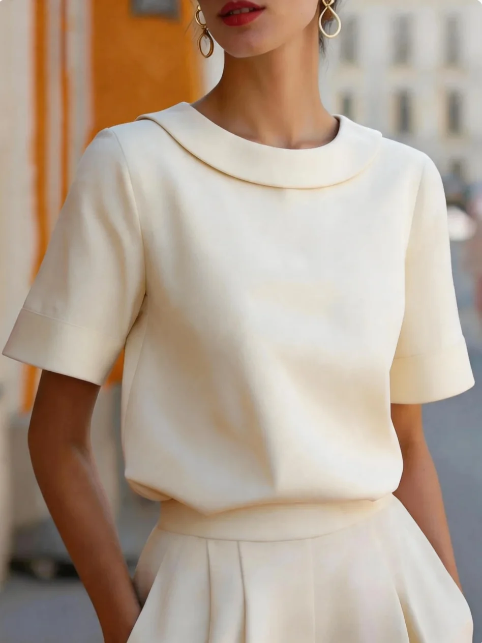 Elegante Kurzarmbluse mit abgerundetem Kragen und strukturierter Passform für Damen im Büro oder für formelle Anlässe. – Detail 12
