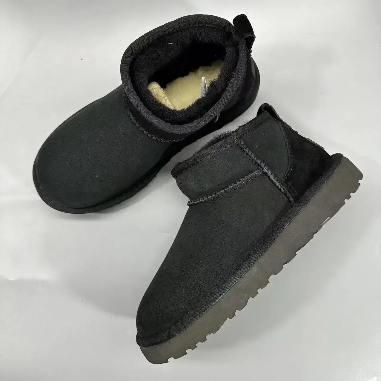 Botas curtas de lã de carneiro real para homens e mulheres, sapatos de pele quente para senhoras, botas de neve de alta qualidade inverno