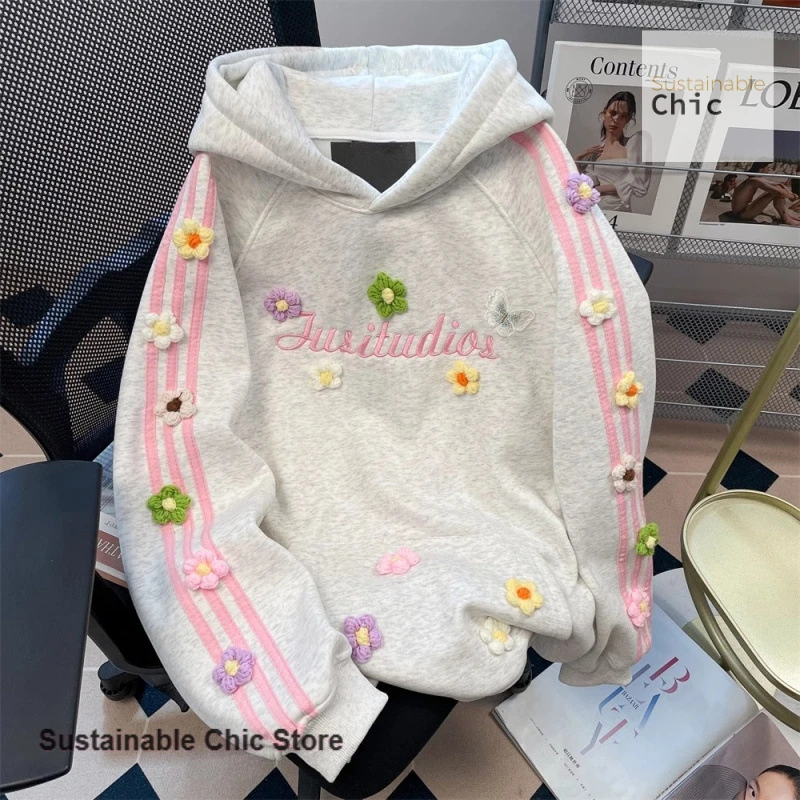 

Korean style three-dimensional flower hooded sweater women's autumn and winter new sweet contrast striped casual Joker coat