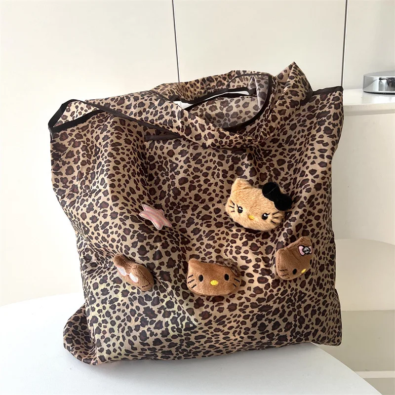 Nuova borsa a tracolla HelloKitty in pelle nera con stampa leopardata borsa carina da pendolarismo estiva da donna di grande capacità