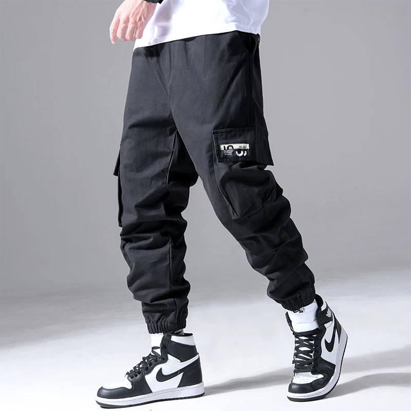 Moda męska Hip Hop Cargo spodnie z wieloma kieszeniami modna odzież uliczna solidne spodnie dresowe Casual bawełniane biegacze męskie — zdjęcie 3