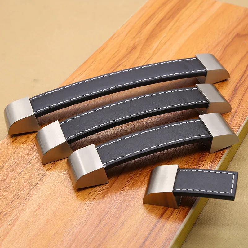 亜鉛合金手作りレザーハンドルモダンなヨーロッパスタイルのソフトシンプルなドアキャビネット引き出しキッチンキャビネットワードローブハードウェア