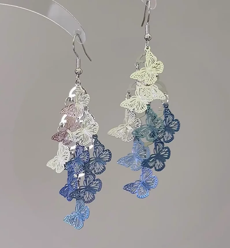 

Blue and white hollow butterfly tassel earrings, Korean style, exquisite design, artistic ear hooks, stud earrings for women.