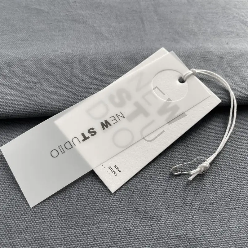 100 sets of high-end trendy tags with semi transparent special paper for men's and women's clothing in stock