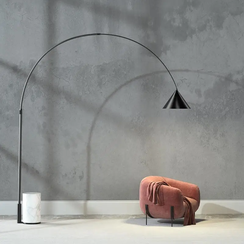 Standing lamp designer coffee table, parabolic marble fishing lamp in the model room of the sales office next to the sofa