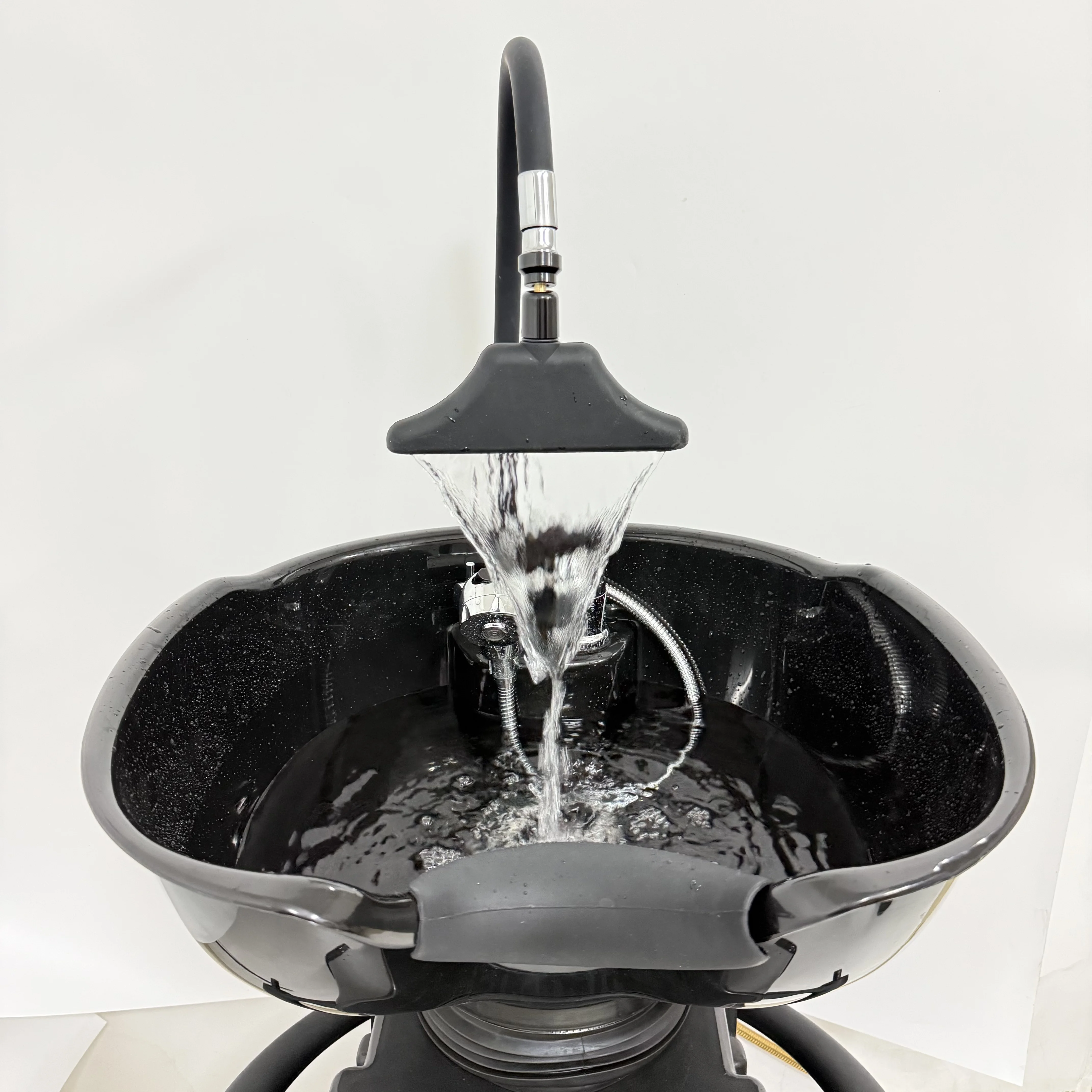 Adjustable water circulation shampoo basin with modern waterfall-style shampoo spray head and faucet