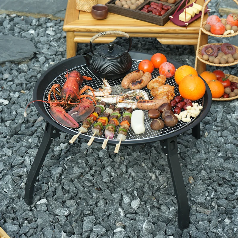 

Complete set of outdoor carbon grill, table and fire pit for making tea around the stove