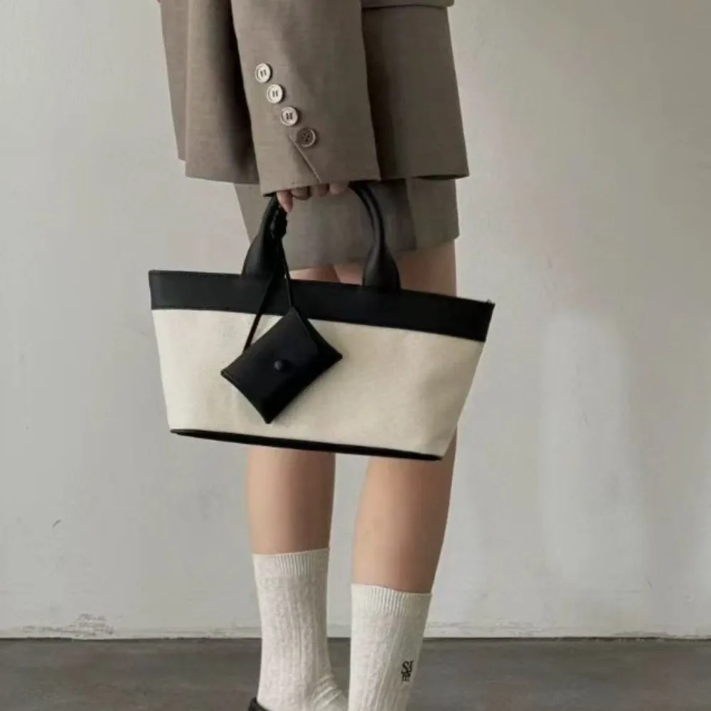 

2026 New Canvas Splicing Cowhide Handbag Women Trendy Tote Premium Minimalist Unique Texture Versatile Advanced Fashion NO LOGO