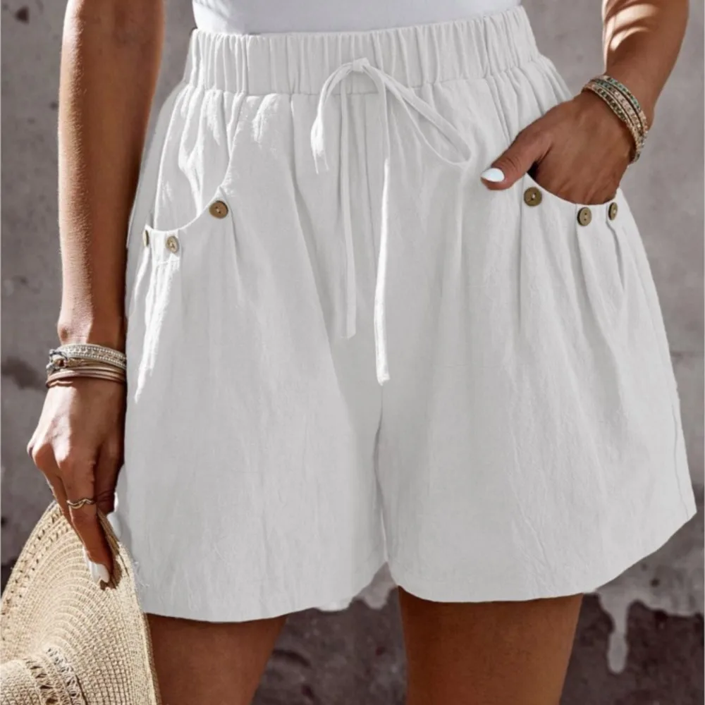 2025 novo estilo de verão feminino casual solto shorts bolso viajando all-match estilo simples quente na moda botão cor sólida moda