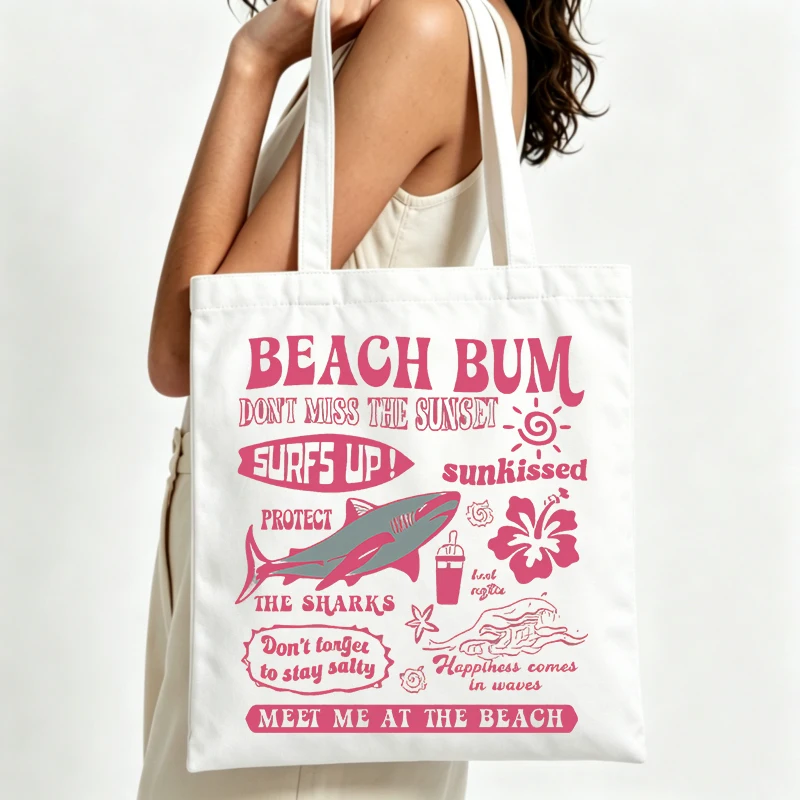 beach graphic canvas tote bag with retro typography print, ideal for summer beach outings and casual shopping
