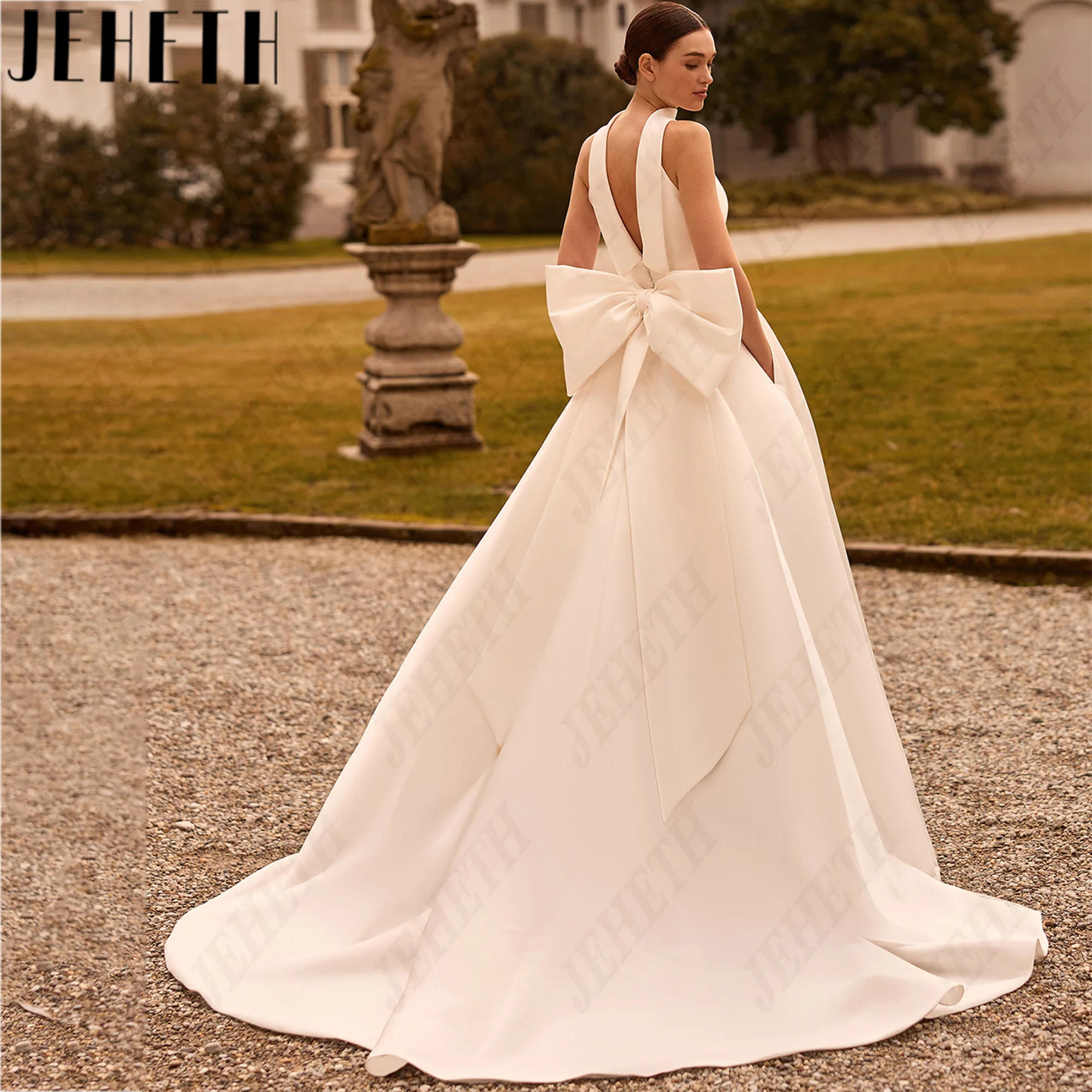 JEHETH High Neck Satin A Line Wedding Dress Big Bow Backless Sleeveless Bridal Gown Sweep Train Pocket Bride Dresses Custom Made