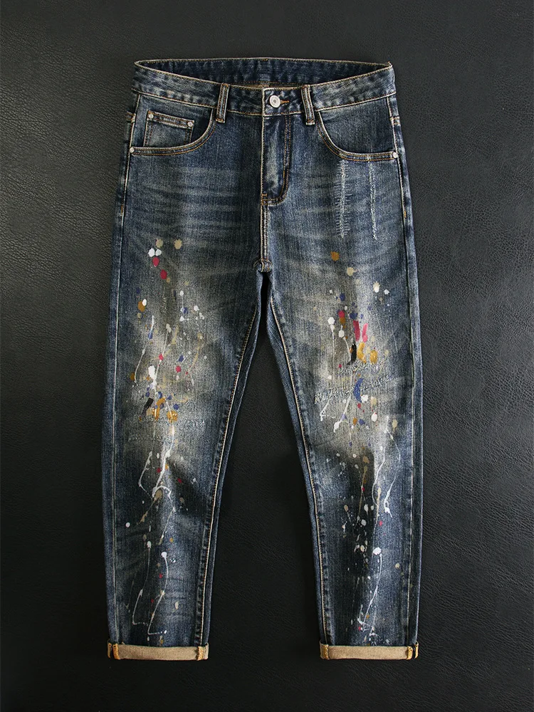 

Осенние модные мужские джинсы с рваными дырками, принтом брызг граффити, резинкой, уличные брюки в стиле ретро.