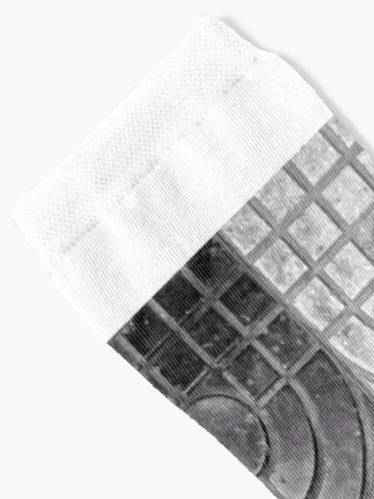 A black and white photo of black and white dirty stone tiles used for covering floor Socks hip hop Male Socks Women's