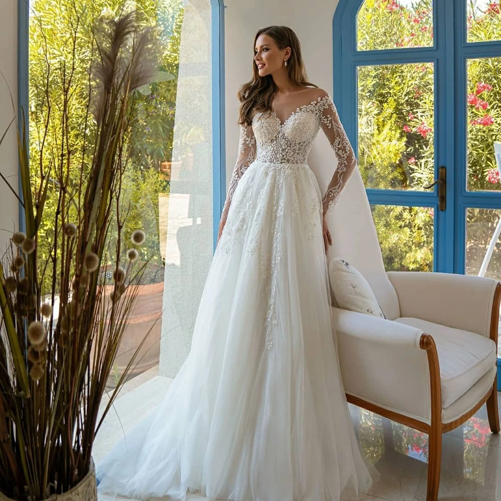 

Elegant Wedding Tulle Long Sleeve Illusion Beaded A-Line and Floor Length Customized Bridal Marring Dresses in Multiple Sizes