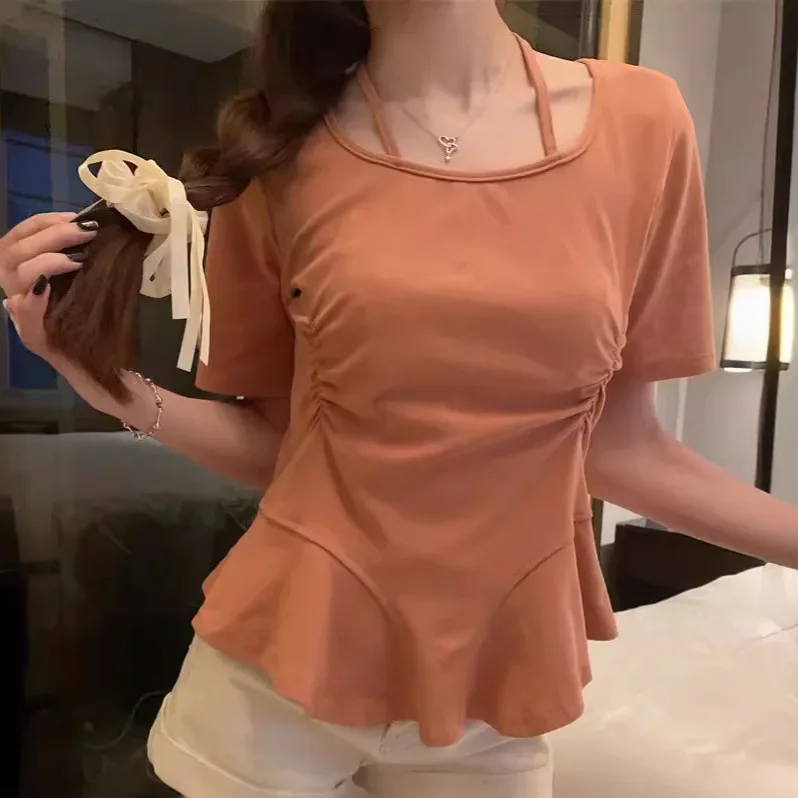 Short-sleeved T-shirt women's 2024 summer new fashion design sense hanging neck sling irregular waist bottoming niche top.