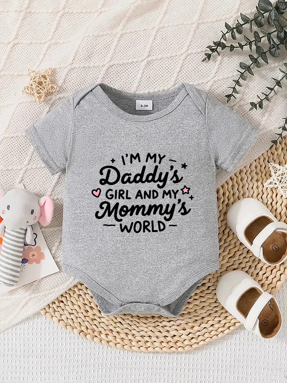 Playful letter-printed baby short-sleeve triangle bodysuit. Button closure for easy dressing, machine washable