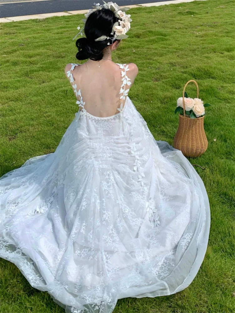 Robe de plage blanche Style Boho féerique pour femmes, maille brodée, bretelles papillon, longue robe en dentelle, sans manches, ample, vacances