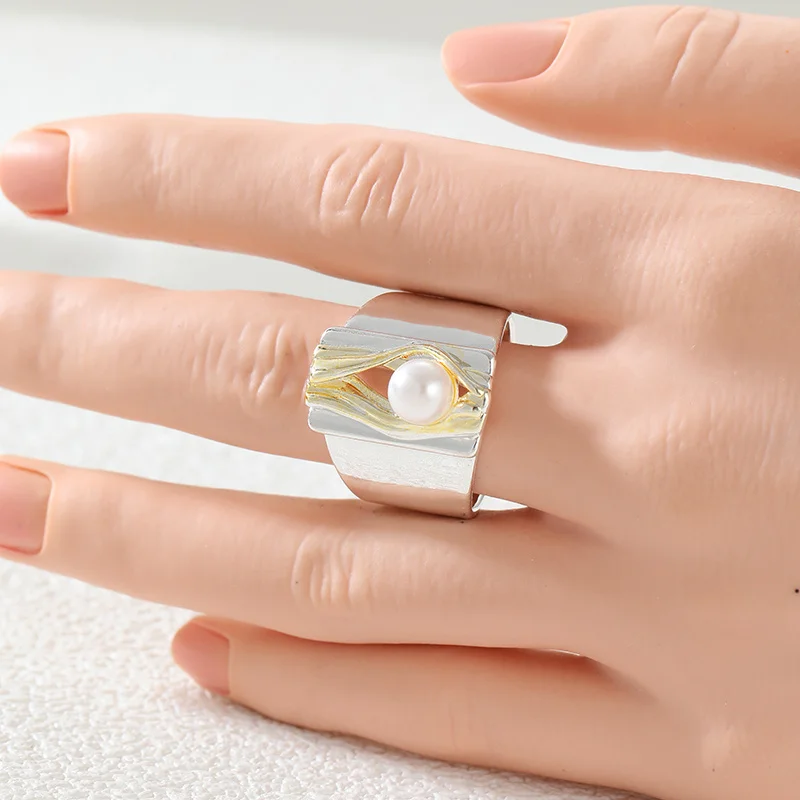 Abstract Wide Cocktail Ring Two Tone Silver and Gold Twisted Interwoven Straps Wrapped Imitation Pearl Ring Daily Wear At Partie