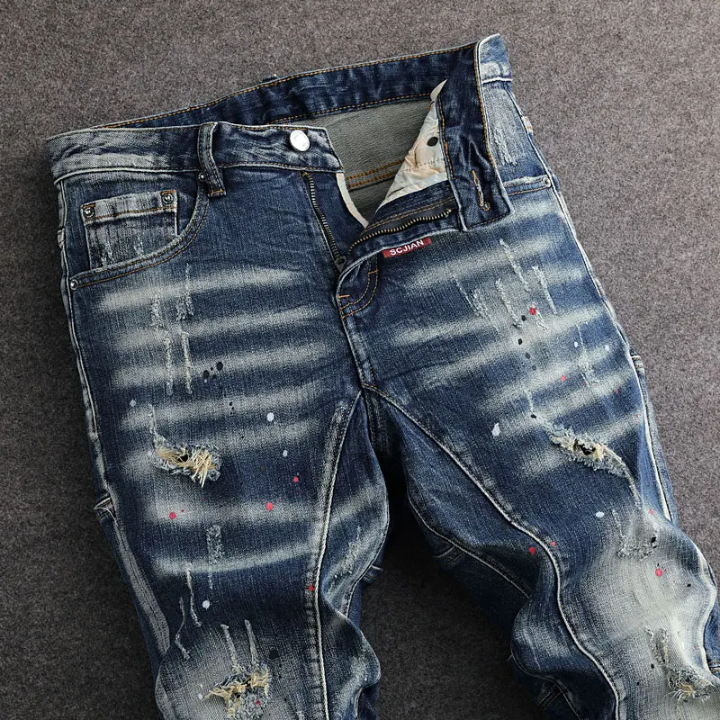 Jeans da uomo di moda di strada Jeans strappati Slim Fit elasticizzati blu lavati retrò da uomo pantaloni di Jeans Vintage Hip Hop firmati dipinti Hombre