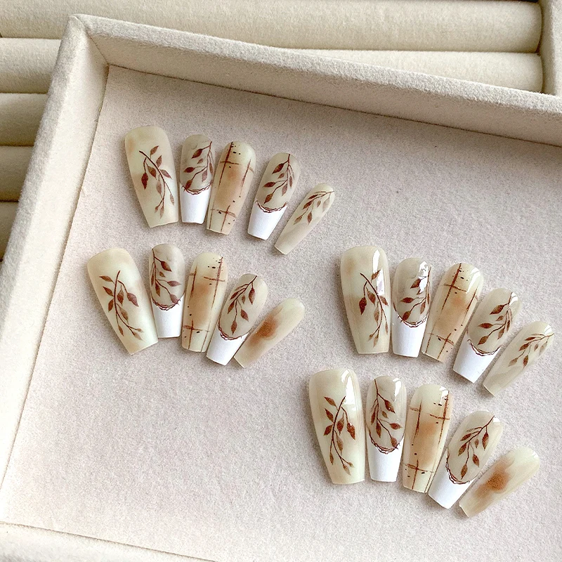 

10pcs pure handmade coffin shaped nail art, beautiful fake nails, warm toned leaf nail art, suitable for girls to use