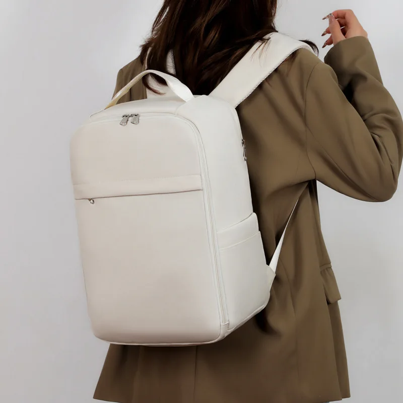 Europe and the United States business computer bag travel color travel bag student solid color large capacity backpack.
