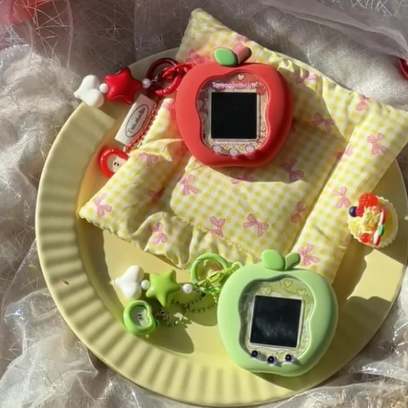 حافظة حماية من السيليكون من Tamagotchi Uni Smart Uni Pet Machine باللون الأخضر والأحمر Apple Uni مع أوراق لوحة وسلاسل المفاتيح وهدايا عيد الميلاد