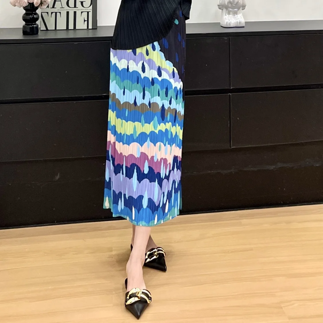 Mezza gonna casual a pieghe Miyake 2025 Estate nuova mezza gonna stampata allentata elasticizzata dal design alla moda