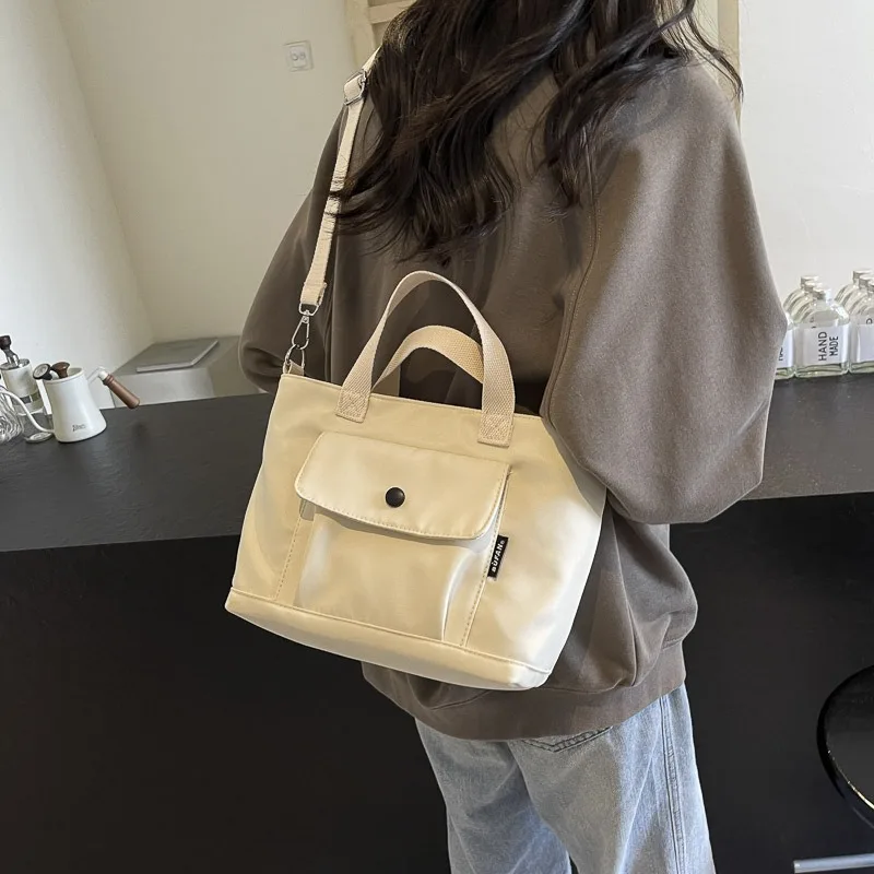 

Large capacity nylon Japanese tote bag 2025 new simple solid color commuter college students shoulder casual crossbody bags