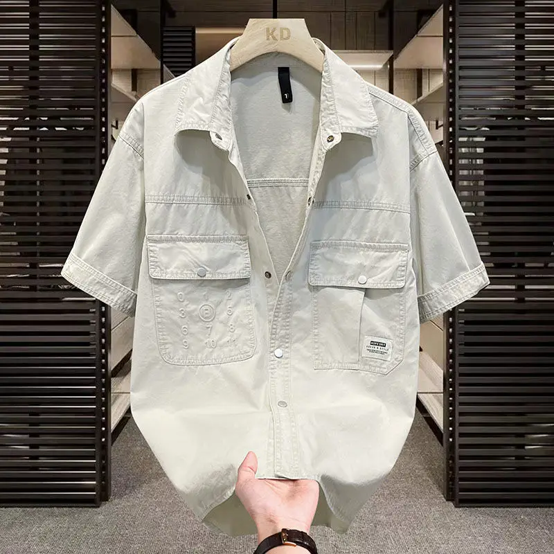 Camicia di jeans da uomo estiva manica corta camicia da uomo Casual allentata in puro cotone di alta qualità Harajuku manica corta Versatile alla