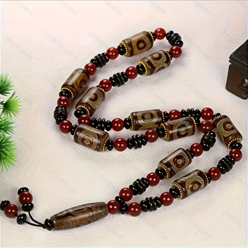 

Natural nine-eyed bead necklace - red, brown and black beads, gold embellished sacred artifacts, perfect holiday gift