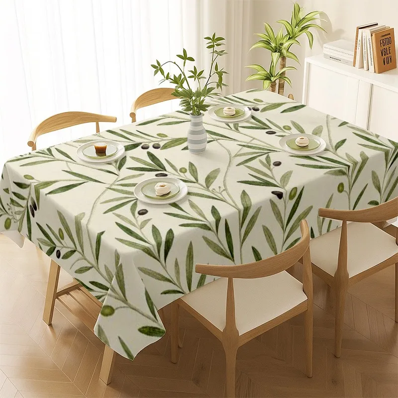 The fashionable soft printed tablecloth is decorated with olive branches and leaves patterns.