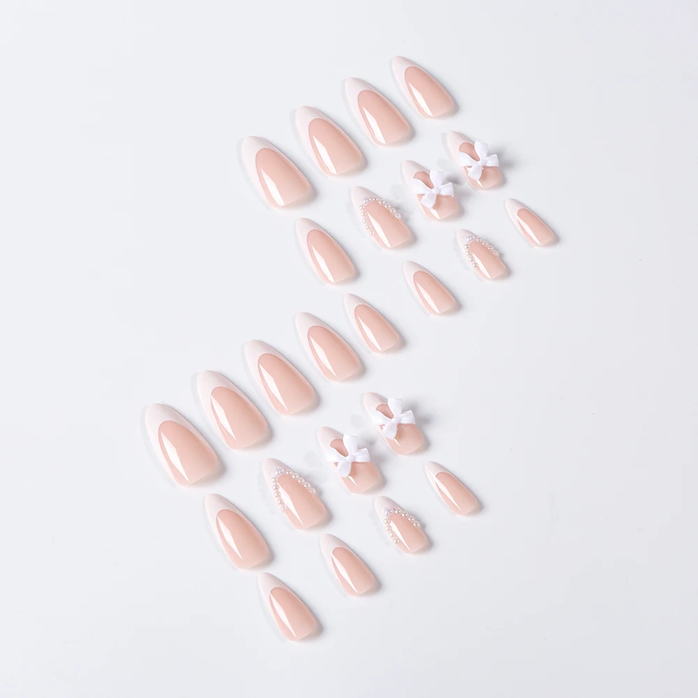 24PCS Medium White Pearl กดบนเล็บอัลมอนด์/Stiletto สีชมพู Bowknot ปลายนิ้วภาษาฝรั่งเศสคําน่ารักเล็บปลอมเต็มเล็บปลอมชุด