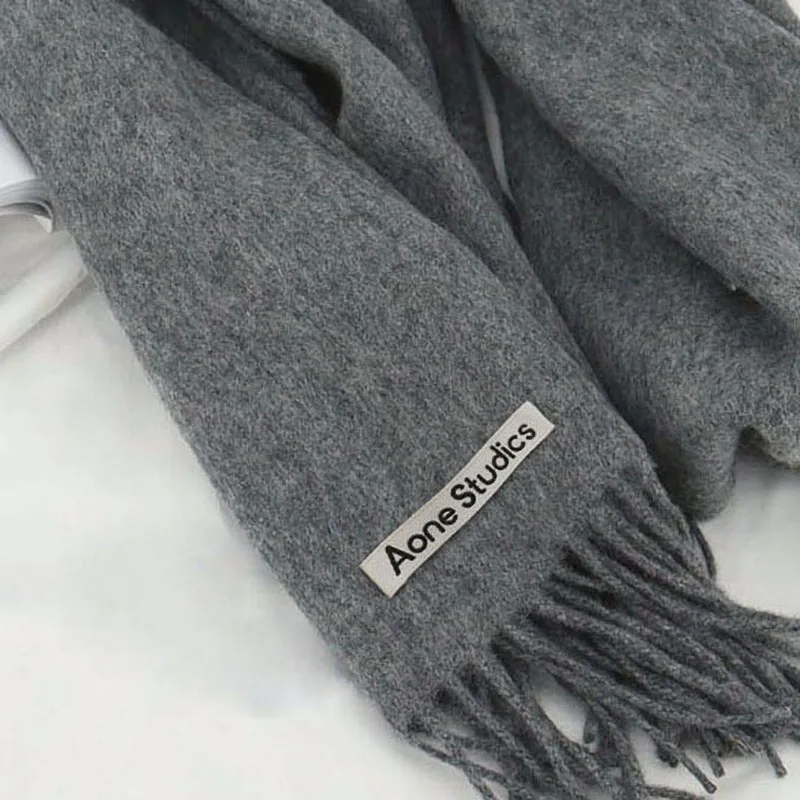 Bufanda de lana 100% de marca de lujo para mujeres y hombres, bufandas de lana auténtica lisas de Color sólido, chal de Cachemira cálido a la moda de invierno para mujer 2025