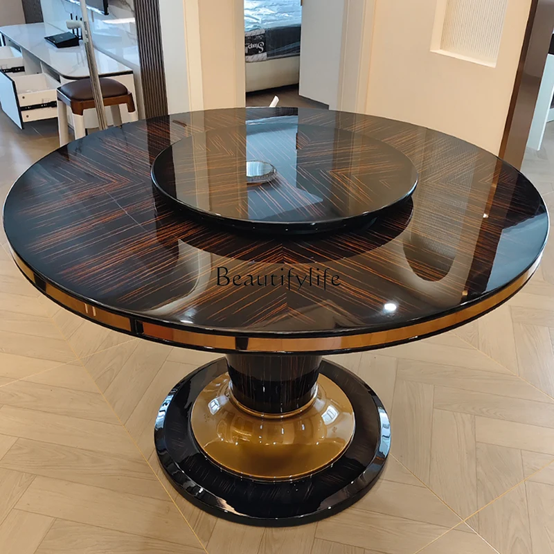 

Italian light luxury dining table solid wood round table leather high-end household simple ebony paint