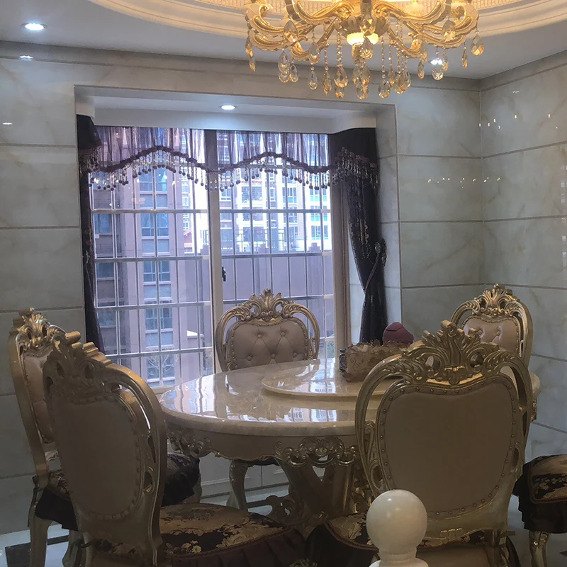 Mesa redonda europea de mármol de jade de hielo blanco, mesa de comedor y silla dorada, combinación de mesa de comedor de madera maciza de lujo europea