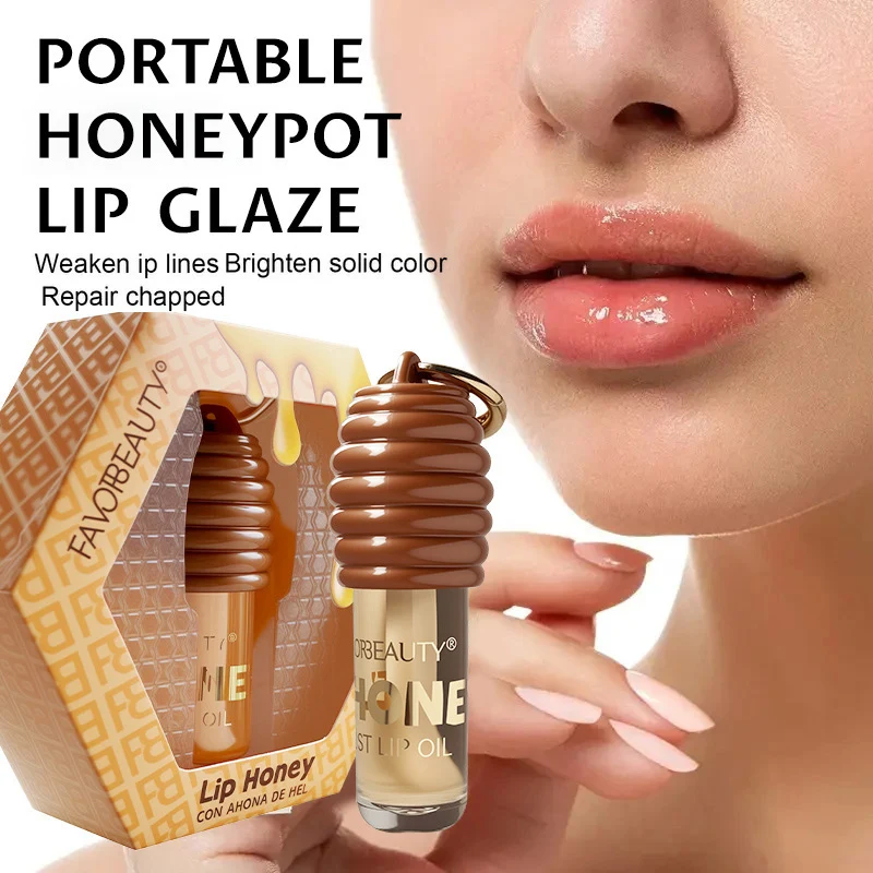 ลิปกลอสเนื้อฮันนี่ แบรนด์เอสเซนส์ ลิปบาล์ม บำรุงริมฝีปากให้ชุ่มชื้นยาวนาน ลดเลือนริ้วรอยริมฝีปาก พกพาสะดวก พร้อมพวงกุญแจ ลิปกลอสใส บำรุงริมฝีปาก