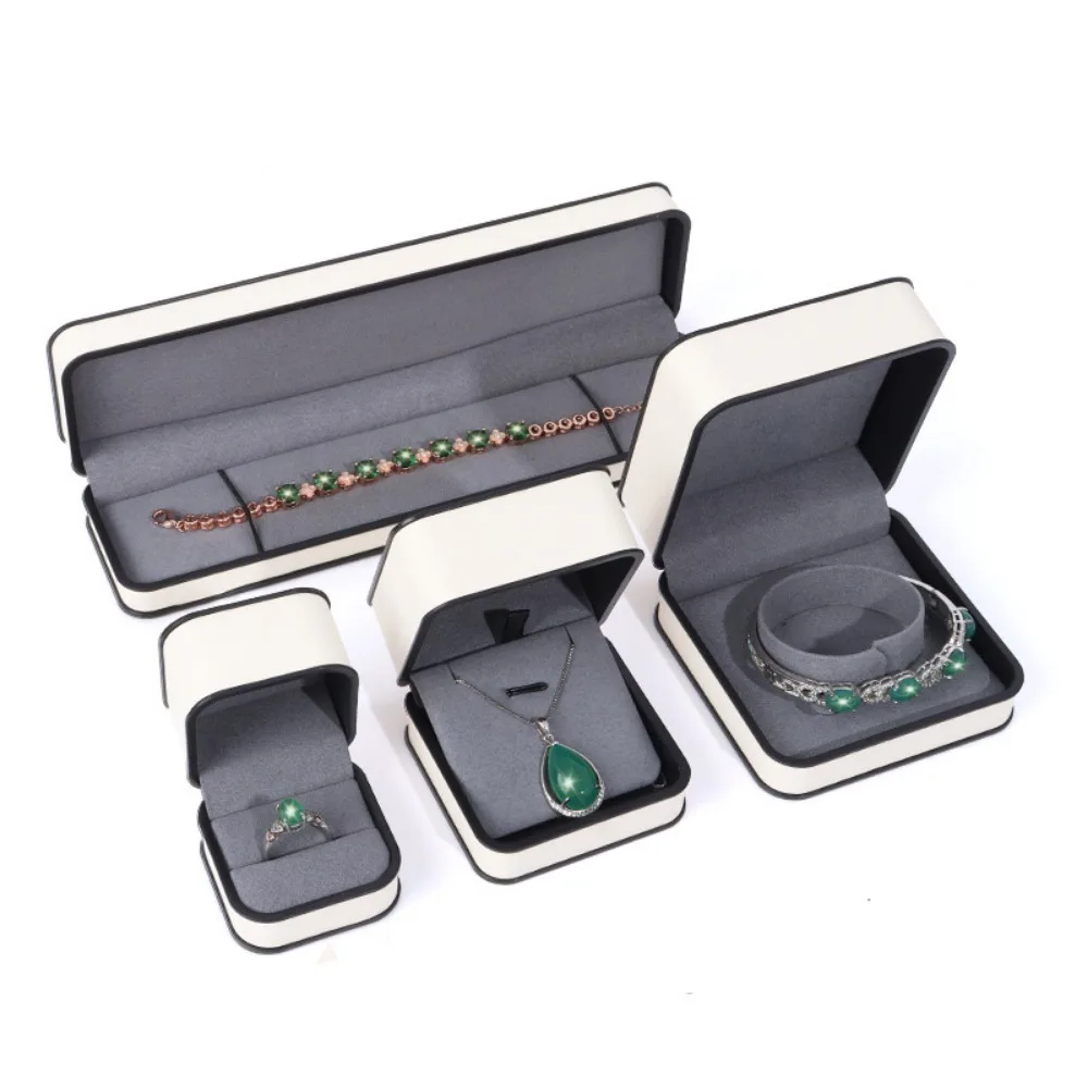 

Luxury Rectangular PU Jewelry Box Black Edge Round Corner Flap Jewelry Packaging Boxes Fashion Bracelet Storage Boxes Proposal