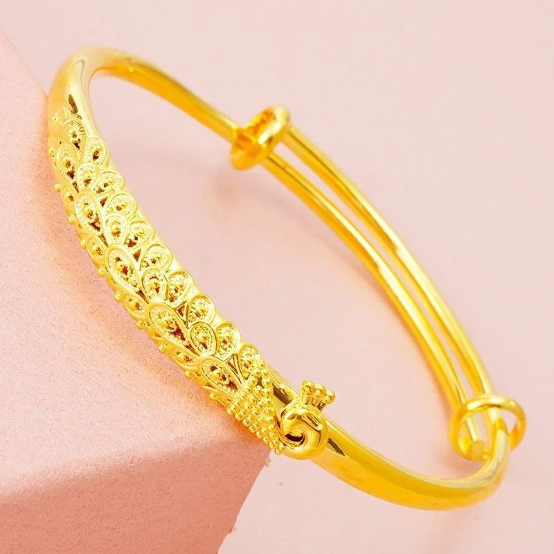 Luxurious 24K 9999 pure gold bracelet carved with peacock design, featuring an adjustable clasp