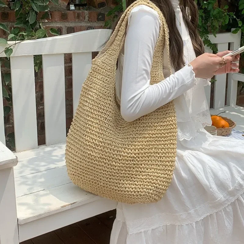 High-end hand-woven straw tote bag for women – large capacity beach vacation bag with versatile seaside style view 3