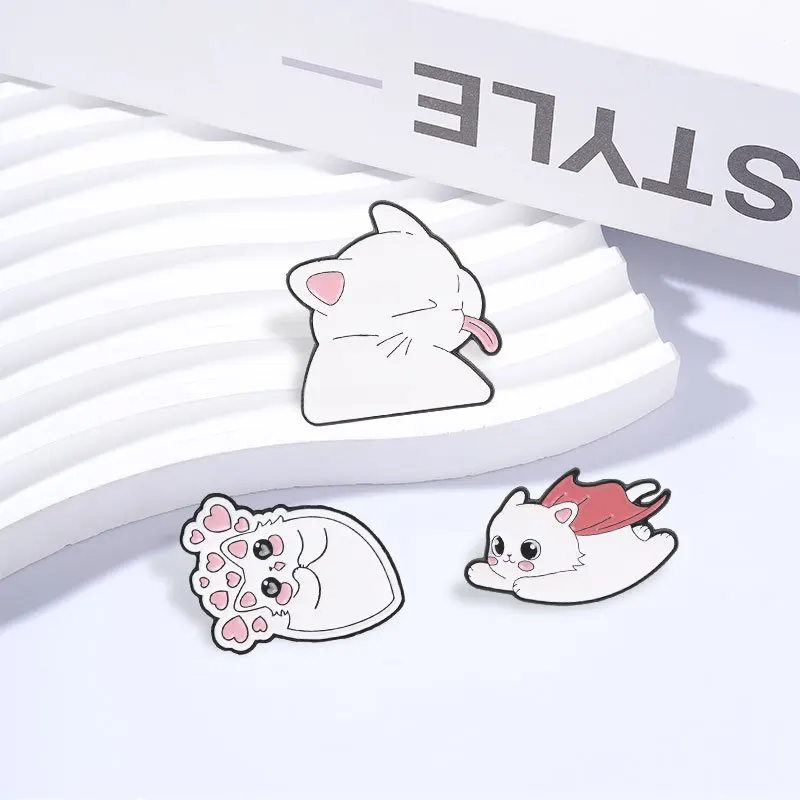 Cute White Cat Enamel Pins Cartoon Shy Heart Tongue Out Kitten Super Hero Kitty Brooches Strabismus Cat Animal Badge Jewelry Gif