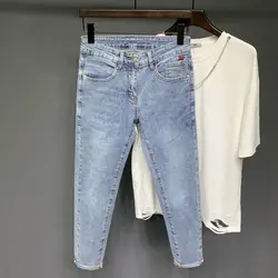 Jeans Casual lavati elasticizzati blu chiaro moda estate per uomo pantaloni strappati con fori strappati in Denim elasticizzato elegante coreano