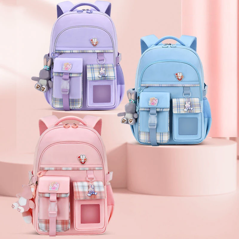 Beliebte rosa lila Farbe Mädchen High School Schüler Rucksack Taschen Oxford Rucksack für Frauen klassische kausale Puppe Anhänger Tasche